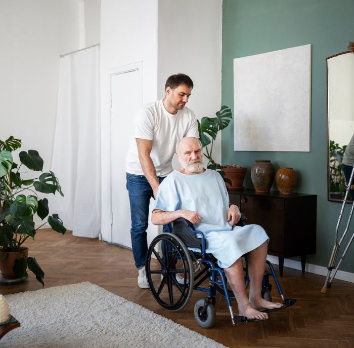 SIL support for elderly man in wheelchair